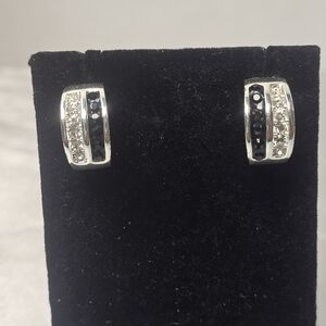 Elevate your jewelry collection with these striking hoop earrings from Roman.